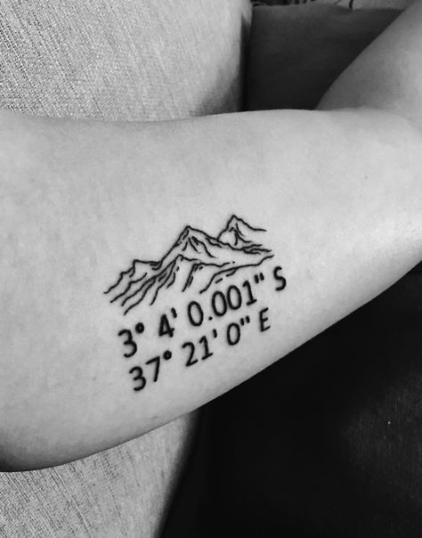 My mountain tattoo with coordinates of Uhuru Peak #mountain #Kilimanjaro #UhuruPeak #tattoo #innerbicep Mountain And Coordinate Tattoo, Mountain Coordinates Tattoo, Coordinates Tattoo Mountain, Mountain Tattoo With Coordinates, Tattoo With Ashes, Tattoos With Coordinates, Peak Tattoo, Mens Mom Tattoo, Longs Peak Tattoo