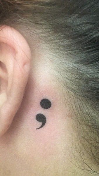 The semi colon project is a movement created to remind those who suffer that it doesn't need to end; we can keep going. My placement behind my ear was chosen because someone is always willing to listen. Semi Colon Behind Ear Tattoo, Semi-colon Tattoo Behind The Ear, Semi Colon Tattoo, Colon Tattoo, Semi Colon, Mark Tattoo, Semicolon Tattoo, Side Tattoos, The Ear