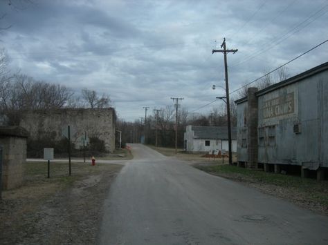 In some parts of East Calico Rock, the only reminders of the modern era are the traffic cones you can barely see in the distance. Rural Horror, Horror Places, Small Town Horror, Hashima Island, European Gothic, Small Town Aesthetic, Twd Aesthetic, Small Town Mystery, Midwest Gothic