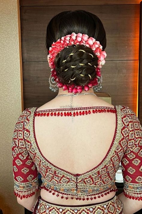 Introducing 85+ Bridal Bun Hairstyles for Wedding. #weddingbazaar#indianwedding #bridalhairstyle #bridalbunhairstyleindianflower #bridalbunhairstyleindian #bridalbunhairstyleindianflowerfrontlook #bridalbunhairstyleindianflowerfront #bridalbunhairstyleindianflowersimple #bridalbunhairstyleindianweddingupdo #floralbridalbun #floralbridalbunwithroses #floralbunindianbride #floralbunbridal #floralbunwhite #floralbunweddingupdo #floralbunindian #floralbunhairstyle #floralbun Blouse Design For Bride Lehenga, Bridal Lehenga Blouse Designs Back, Lehenga Blouse Back Designs, Lehenga Blouse Designs Back, Sleek Bridal Bun, Bun Bridal Hairstyles, Bridal Latkan, Bridal Lehenga Blouse Designs, Bun Hairstyles For Wedding