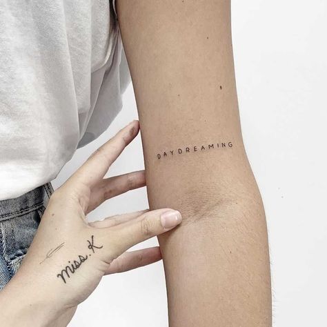 Daydreaming Tattoo, Word Tattoos On Arm, One Word Tattoo, Word Tattoo Ideas, Left Arm Tattoos, Tattoo On Arm, Belly Tattoos, Ribcage Tattoo, Word Tattoo