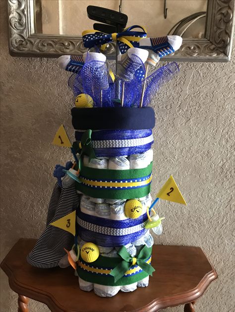 Golf bag diaper cake Gender Reveal Golf Theme, Golf Baby Shower Theme, Golf Diaper Cake, Golf Themed Baby Shower Ideas, Golf Bag Diaper Cake, Golf Baby Shower Ideas, Golf Baby Showers, Unique Diaper Cakes