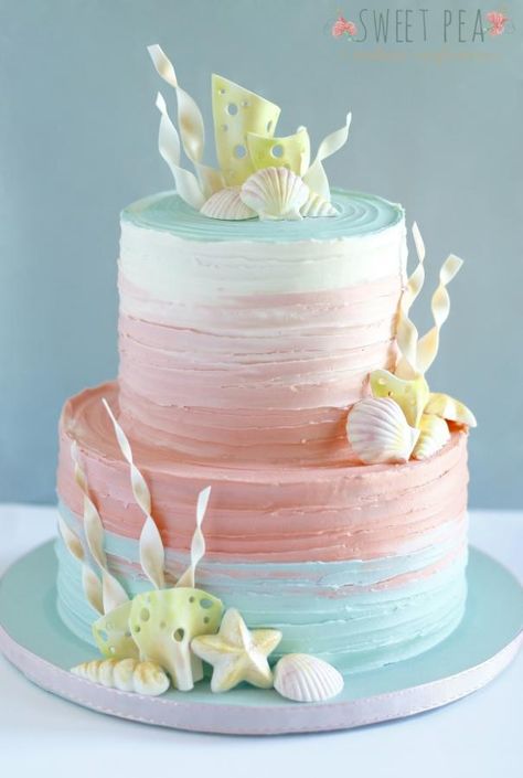 This ombré cake was made for an underwater themed baby shower. It’s a beautiful technique to use, especially for cakes that are very light and airy. Pink Under The Sea Cake, Coral Cake Ideas, Shell Birthday Cake, Seashell Birthday Cake, Beach Cake Ideas, Beachy Cake, Teal Cake, Beach Birthday Cake, Sea Cake