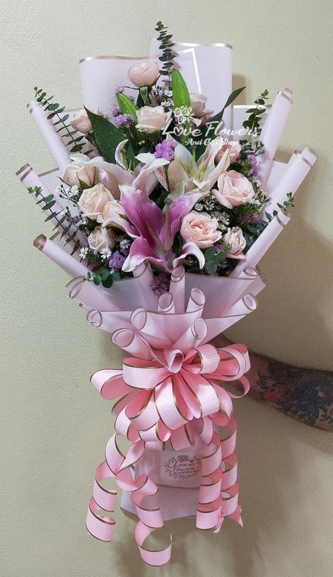 Lily and peach roses bouquet with assorted fillers Peach Roses Bouquet, Hotel Flower Arrangements, Hotel Flowers, Roses Bouquet, Krishna Songs, Bouquet Ideas, Peach Roses, Flower Nails, Rose Bouquet