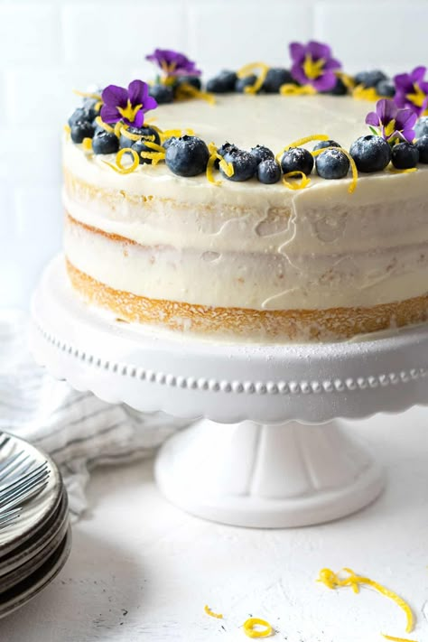 Lemon Blueberry Cake - El Mundo Eats Lemon Cake Blueberry Frosting, Blueberry Orange Cake, Lemon Blueberry Birthday Cake, Lemon Blueberry Cake Decoration, Lemon Cake Decoration Ideas, Birthday Lemon Cake, Best Lemon Blueberry Cake, Blue And Yellow Cake, Blueberry And Lemon Cake