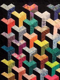 Quilt Inspiration: Quilts of illusion: tumbling blocks Tumbling Blocks Quilt, Optical Illusion Quilts, Colchas Quilting, Tumbling Blocks, English Paper Piecing Quilts, 3d Quilts, Geometric Quilt, Batik Quilts, Patchwork Quilt Patterns