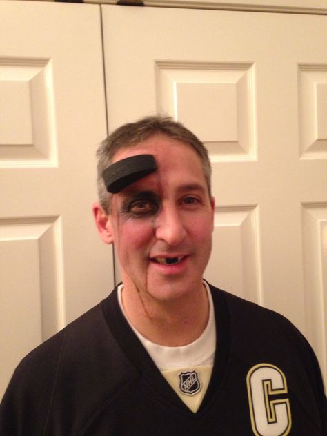 Hockey player puck in forehead.   Tips: foam puck curved to head. Use double stick Velcro and stick to clean (wipe with alcohol) skin. Double stick Velcro worked much better than spirit glue which was too runny. Zombie Hockey Player Costume, Ty Costume, Puck Costume, Hockey Halloween Costume, Hockey Costume, Hockey Player Costume, Hockey Referee, Hockey Halloween, Jack Halloween