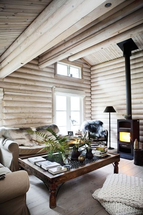 Interiors | Country Retreat | Dust Jacket | Bloglovin’ Dark Log Cabin Homes Interior, Tiny Fireplace, Painted Log Home Interior, Cabin Walls, Norwegian Interior, Norwegian Cabin, Interior Cabin, Log Home Interior, White Cabin