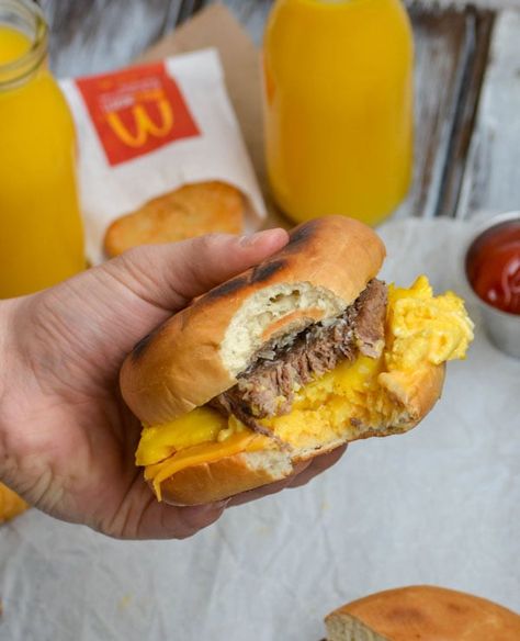 a hand holding up a copycat mcdonalds steak egg and cheese bagel with a bite taken out of it Mcdonald's Steak Egg And Cheese Bagel, Steak Egg And Cheese Bagel, Copycat Mcdonalds, Egg And Cheese Bagel, Minute Steak, Seasoned Steak, Breakfast Bagels, Bagel Sandwiches, Egg Bagel