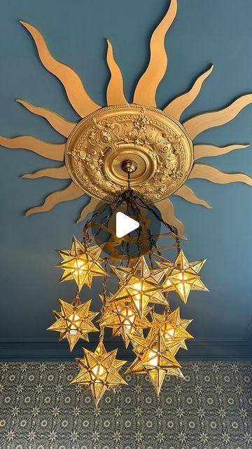 Helena Garcia on Instagram: "I’ve been working on the biggest bedroom in the house for weeks! And although it isn’t quite finished I wanted to show you what I did with the main light fitting.  It seems the Victorians limited their ceiling roses and ornate covings etc to the ground floor as there’s none upstairs but I found this reclaimed one on marketplace for £20! It’s huge but this room is so big it doesn’t look it.  It is a south facing bedroom and incredibly light so I thought it would be nice to represent that with a sun shape ceiling rose 🌞 The paint and wallpaper both came from @warnerhouse_1870 and I have to say that the paint was so thick I only needed to do one coat! With the size and height of this ceiling let me tell you that was a godsend!  I hope you like it ☺️  #interiordes Witchy Ceiling Light, Fantasy Ceiling Light, Gold Stars Ceiling, Star Lighting On Ceiling, Stars Celling Design, Star Ceiling Medallion, Sun Ceiling Design, Apartment Ceiling Light Ideas, Sun Ceiling Light