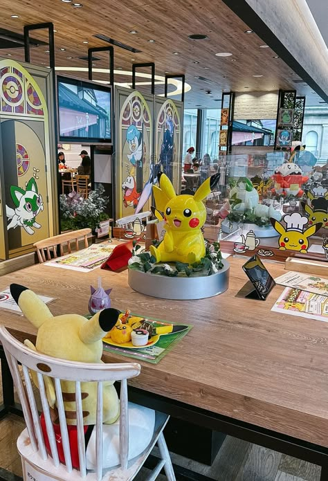 Calling all Pokémon fans! Discover a must-visit café in Tokyo, Japan on Mommy Diary. Immerse yourself in the enchanting world of Pokémon at this captivating themed café. Indulge in delectable Pokémon-themed food surrounded by captivating café decor and mesmerizing Pikachu chairs. Planning a Tokyo trip? Don't miss this unique place to eat and shop! Explore the best-themed cafés in Tokyo and delight in the intricate Pokémon decorations. Experience Tokyo travel tips like never before! Pokemon Store Tokyo, Pokemon Cafe Japan, Themed Cafes In Japan, Pokemon Cafe Tokyo, Pokémon Decorations, Japan Activities, Tokyo Japan Aesthetic, Pokémon Cafe, Places To Visit In Tokyo