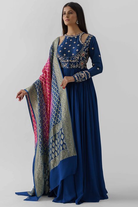 Featuring a peacock blue anarkali in georgette crepe and tussar silk base with peek-a-boo neckline and hand embroidery. It is paired contrasting pink banarasi woven dupatta having bandhani print. NOTE: The design of the dupatta may vary according to availability. Color will remain the same.   FIT: Fitted at bust. COMPOSITION: Georgette crepe, Tussar silk, Banarasi. CARE: Dry clean only. Drama Clothes, Anarkali Designs, Anarkali With Dupatta, Indian Gown, Scallop Dress, Blue Anarkali, Anarkali Dresses, Bandhani Dress, Embroidered Anarkali