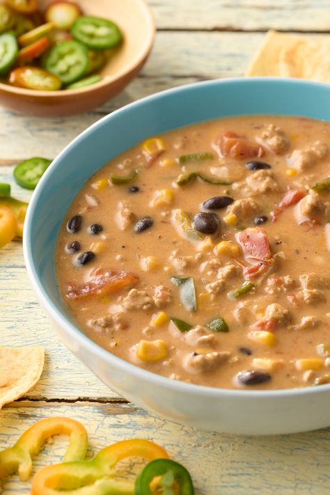 Slow Cooker Turkey Nacho Soup, a flavor-packed creation featuring premium JENNIE-O® Ground Turkey and a medley of vibrant ingredients. This delightful soup is a set-and-forget dinner option that promises a burst of savory goodness. Soup Turkey Ground, Soup With Ground Turkey Healthy, Ground Turkey Soup Crockpot, Ground Turkey Slow Cooker Recipes, Soup Ground Turkey, Turkey Nachos Recipe, Ground Turkey Soup Recipes, Ground Turkey Slow Cooker, Ground Turkey Nachos