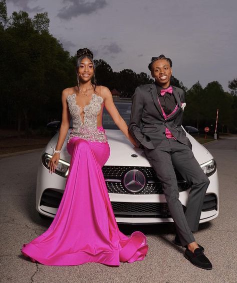 Pink And Silver Prom Couple, Prom Pictures At Night, Pink Prom Dresses With Date, Black And Pink Prom Couple, Prom Poses With Car, Prom Couples Pink, Prom Couples Black People, Pink Prom Couple, Prom Picture Poses For Couples