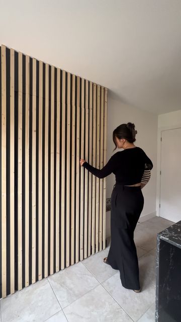 Holly on Instagram: "DIY Hidden Wood Slat Door - Laundry day just got way cooler!! Despite what you can see it’s not finished, there are about 20 wall slats to go on, but I still got the shot!🤍 I’ve had so much interest in my reels for this little project, I appreciate all of the advice too. It’s a huge feature in the kitchen now 🖤" Wood Slat Door, Slat Door, Wall Slats, Slate Wall, Forest View, Hidden Door, Laundry Day, Instagram Diy, The Shot