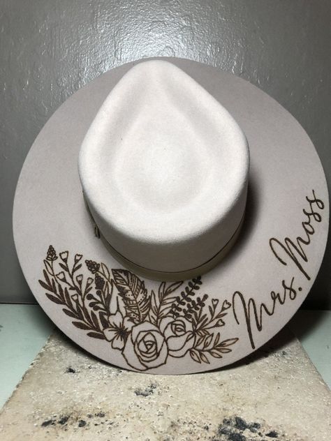 "We love our modern country brides! We design unique hats with our beautiful brides in mind, this is the perfect modern country accessory to wear on your big day and beyond! This hat is perfect for the bride who loves minimal custom design! The perfect hat for every season of weddings. These hats are felt/wool with a wide, flat brim.  Sizes vary for different colors. For Cream and Silverbelly sizes are small, medium, and large. Ivory hats are one size fits all. Hats come in four colors; Cream, S White Wedding Hat, White Cowboy Hat Wedding, Boho Wedding Hats For Bride, Cowboy Hat Groomsmen, Boho Wedding Hat, Wedding Hats For Bride, Classy Country Wedding, Fall Western Wedding, Bridal Cowgirl