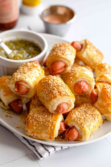 Mini Pigs in a Blanket is a quick and easy recipe for parties and celebrations. This crowd-pleaser is delicious and easy to make with no fuss. This is a quick and easy snack perfect for any day of the year. #jernejkitchen #hotdogs #hotdog #pigsinablanket #puffpastry #snack #partyfood Mini Pigs In A Blanket, Mini Hotdogs, Birthday Breakfast Ideas, Autumn Snacks, Party Snacks Kids, Teaching Kids To Cook, Finger Foods Recipes, Sports Party Food, Pigs In A Blanket Recipe