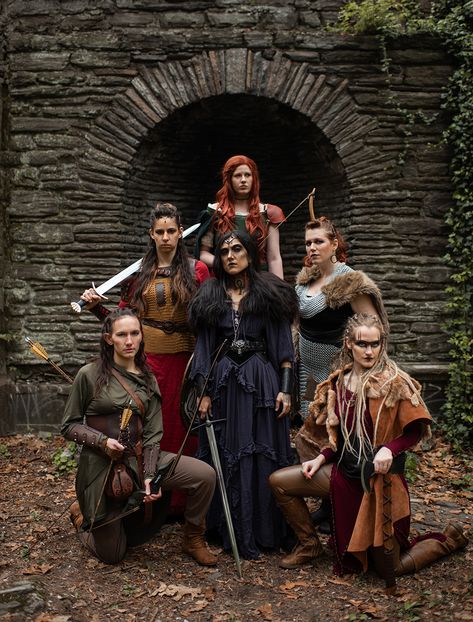 A group of viking warriors stand amidst crumbling ruins with weapons Viking Photoshoot, Norse Aesthetic, Fantasy Photoshoot, Troilus And Cressida, Group Shoot, Adventure Core, Viking Dress, Group Poses, Viking Women