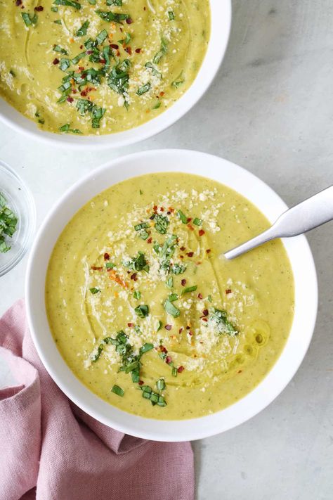 This Zucchini Soup is oh-so-creamy, thanks to the cannellini beans, and deliciously seasoned with a little cheesiness from the parmesan. | Zucchini Soup Recipe | Creamy Zucchini Soup | Zucchini Bean Soup | Chilled Zucchini Soup, Zucchini Bean Soup, Spicy Zucchini Soup, Cream Of Zucchini Soup Recipes, Nutritional Soup Recipes, Zucchini Soup Recipes Creamy, Feelgoodfoodie Recipes, Healthy Vegetable Soups, Soup Zucchini