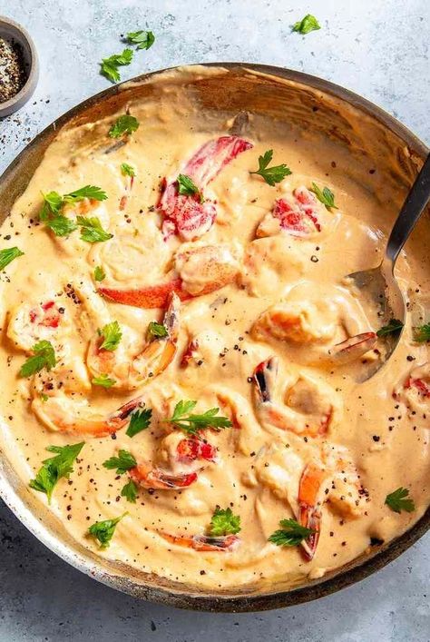 This Seafood Newburg recipe includes lobster, shrimp, scallops, and fish (haddock or hake fillets) simmered in a rich sherry-spiked cream sauce for a decadent retro dinner meal that also happens to be fast and easy. Seafood Newburg Recipe, Shrimp Newburg, Seafood Newburg, Lobster Newburg, Christmas Seafood, Seafood Main Course, Seafood Casserole Recipes, Haddock Recipes, London Broil Recipes