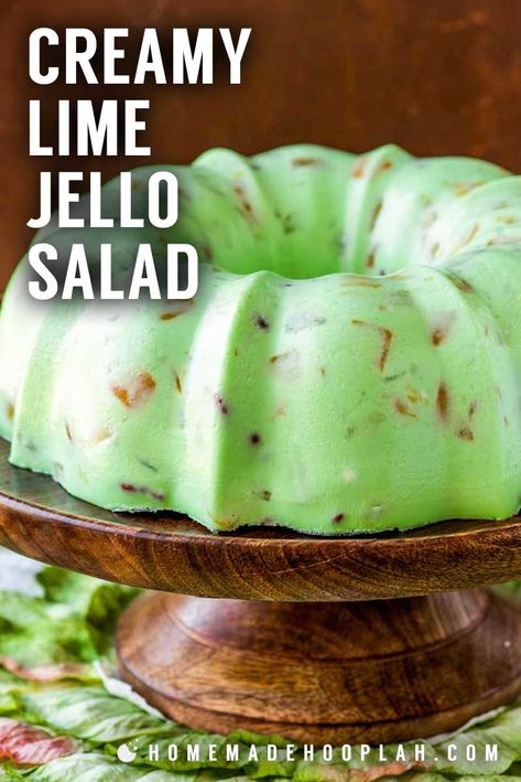 Creamy Lime Jello Salad! This retro flashback dessert is always a hit and certain to be a conversation starter! Flavored with lime jello and thickened with cream cheese and mayonnaise, it has the sweet taste of lime sorbet and a slight crunch from chopped pecans. Customize it with your own fruit fillings or use simple fruit cocktail. | HomemadeHooplah.com Lime Jello Recipes, Lime Jello Salad, Green Jello Salad, Jello Fruit Salads, Jelly Salad, Lime Jello Salads, Jello Mold Recipes, Congealed Salad, Gelatin Salad