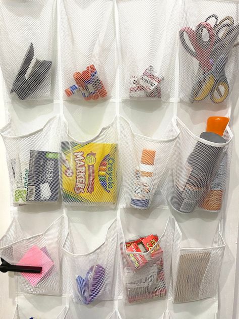 Use a over-the-door shoe organizer to store your supplies and save space! Check out more classroom hacks in this blog post. Classroom Organization Ideas, School Supply Storage, Classroom Organization Elementary, Classroom Hacks, Brag Tags, Best Year Ever, Teachers Lounge, Door Shoe Organizer, Parent Communication