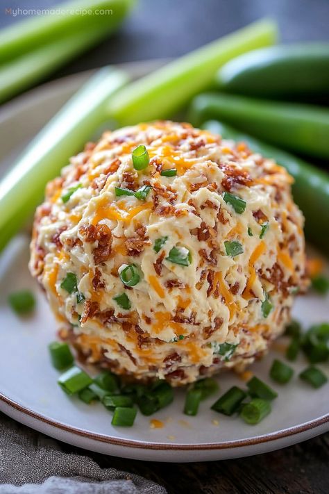 Jalapeño Popper Cheese Ball is a creamy blend of cream cheese, sour cream, jalapeños, and cheddar, coated with green onions, pecans, and extra cheddar. A party favorite! Cheddar Cheese Cheese Ball, Italian Cheese Ball Recipes, No Nut Cheese Ball Recipes, Jalepeno Popper Cheese Ball Recipes, Jalapeno Poppers Cheese Ball, Spicy Cheeseball Recipes, Jalapeno Cheese Ball Recipes, Mexican Cheese Ball Recipes, Spinach Artichoke Cheese Ball