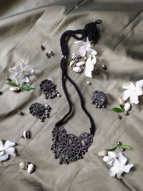 silver toned mirror-works necklace with earrings and adjustable ring Jewellery Photoshoot Ideas, Oxidised Choker, Matte Black Accessories, Jewellery Photoshoot, Black Metal Jewelry, Photography References, Jewellery Shoot, Desi Vibes, Silver Bridal Jewellery