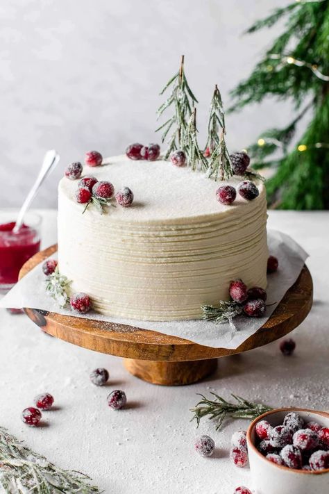 White Christmas Cake - Eats Delightful Almond Christmas Cake, White Christmas Cakes, White Chocolate Cranberry Cake, Naked Christmas Cake, Winter Cake Flavors, Winter Themed Food, Christmas Cake Flavors, Easy Christmas Cakes, Winter Cake Decorating