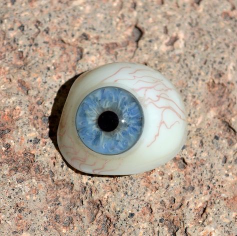 Antique hand-blown glass prosthetic eye - Circa 1920's German origin. The iris is a beautiful light blue color, with subtle hints of grey seeping in from the pupil. The small red veins in the glass, and the color detail in the iris are wonderful. etsy.com/shop/CosmicLibrary Glass Eye Aesthetic, Glass Eye Prosthetic, The Magnus Archives Aesthetic, Magnus Archives Aesthetic, Emo Hippie, Prosthetic Eye, Monsters Under The Bed, Butters Stotch, Monster Under The Bed