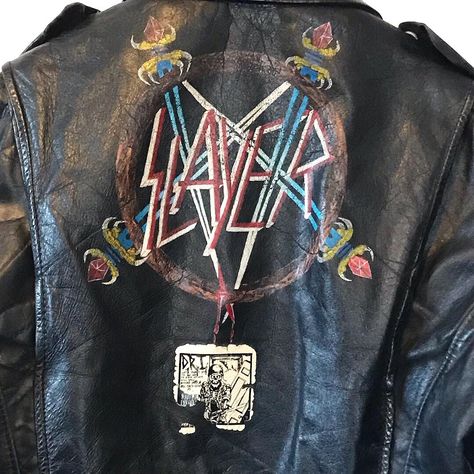 Ghost Town Vintage on Instagram: “Authentic 1980s Slayer black leather battle jacket. Hand painted Pentagram and sword logo on the back in pristine condition.  It even has…” Paint Leather Jacket, Leather Battle Jacket, Jacket Back Patch, Jacket Hand Painted, Battle Jackets, Battle Vest, Painted Leather Jacket, Paint Leather, Battle Jacket