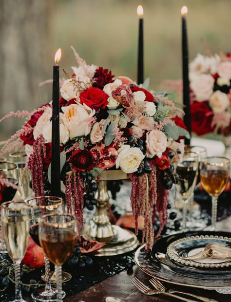 Burgundy centerpiece with pomegranates and dripping amaranthus Halloween Wedding Centerpieces, Flowers And Candles, Halloween Themed Wedding, Dark Wedding, Fall Tablescapes, Moody Wedding, Easy Diy Halloween, Black Candles, Gothic Wedding