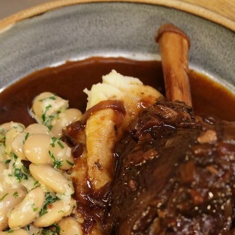 JamesMartin’sSaturdayMorning on Instagram: "Lamb Shanks with Butterbeans, a showstopping dish! Serve with creamy mash and the beautiful sauce from the lamb, made from onions, garlic, bay leaves, red wine, beef stock, tomato puree and sherry vinegar. Absolutely delicious! Recipe link in story and bio! #jamesmartinchef #cooking #weekendfood #jamesmartin #instafood #foodporn #itv #recipe #saturdayjamesmartin #chef #recipeshare #recipeoftheday #recipes #celebritychef #saturdaymorning #midweekmeal # Red Wine Beef, Lamb Shank Recipe, Buttery Mashed Potatoes, Braised Lamb Shanks, Lamb Shank, Creamy Mash, Tomato Puree, Red Wine Sauce, Sherry Vinegar