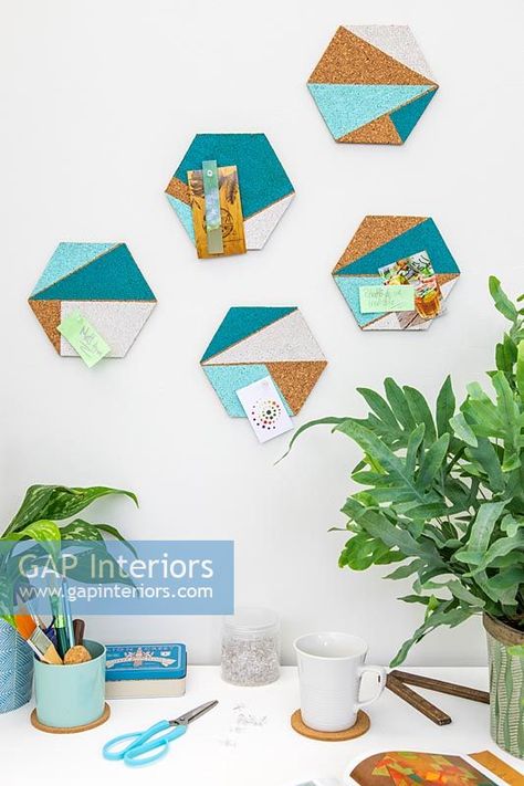 Hexagonal cork shapes with painted geometric areas used for decorative pinboards above desk Hexagon Cork Board Ideas, Hexagon Cork Board, Cork Board Ideas, Fun Room, Boho Office, Hexagon Coasters, Painting Inspo, Interior Photography, Play Room