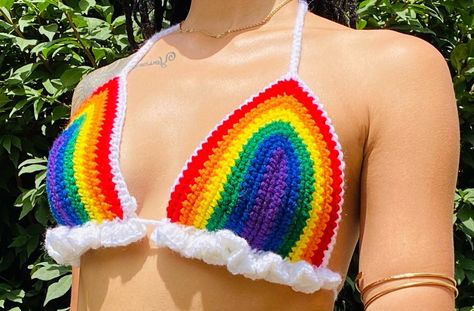 Wear it to Pride events, music festivals, beach parties, or later it under sheer tops for a bold fashion statement. This versatile piece pairs well with high-waisted jeans, shorts, or skirts, allowing you to create endless stylish looks. Crochet lovers, handmade with love, fashion accessories, pride parade, equality, diversity, colorful fashion, trendy style, unique design, fashionable, comfortable fit, summer fashion, body positive, self expression, proud and visible, celebrate love Rainbowcore Fashion, Crochet Bathing Suit Top, Pride Fits, Cloud Crochet, Pride Crochet, Tops A Crochet, Crochet Bralette Top, Rainbow Beauty, Lgbtq Clothing