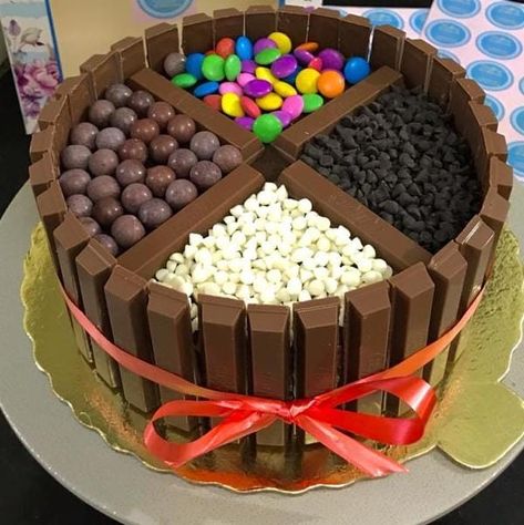 *Kitkat gems cake* is a fudgy ganache and frosted with chocolate buttercream cake topped with gems, white chocolate, dark chocolate shots, and surrounded by Kitkat. *Perfect cake for birthday and anniversary celebrations*🥳🥳 Call us@ 📞 *9671586866* Kit Kat Dessert, Gems Cake, Chocolate Kit Kat Cake, Chocolate Buttercream Cake, Gem Cake, Cake For Birthday, Kitkat Cake, Chocolate Shots, Kit Kat Cake