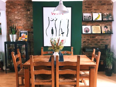 A terraced house dining room featuring green feature wall in emerald green, exposed brick in alcoves and mid-century modern and wood furnishings Green Room Wall, Emerald Green Room, Brick Wall Dining Room, Brick Dining Room, Emerald Green Rooms, Green Dining Room Walls, Green Feature Wall, Dining Room Feature Wall, Brick Wall Living Room