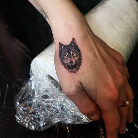 The Top 95 Best Wolf Tattoos in 2020 Wolf Tattoo On Hand, Wolf Tattoo Ideas For Men, Wolf Face Tattoo, Wolf Paw Tattoos, Simple Wolf Tattoo, Wolf Pack Tattoo, Celtic Wolf Tattoo, Watercolor Wolf Tattoo, Howling Wolf Tattoo