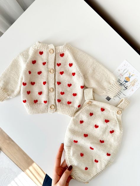 Hand knitted hearth embroidered baby cardigan and romper set is a classic baby and children's outfit made of 55% Baby Alpaca, 45% Merinos.  This love hand-knitted baby cardigan and romper set will suit your baby very well! A wonderful baby outfit with its soft texture and heart embroidery! Also, this heart-patterned hand-knitted baby cardigan and romper set is a great photo prop for a newborn photo shoot! If you are looking for a gift for your grandchild, the hand-knitted  baby love cardigan and Baby Dress Embroidery, Crochet Baby Costumes, Knitted Baby Outfits, Vintage Baby Boys, Baby Coming Home Outfit, Handmade Baby Clothes, Cardigan Knitted, Knitted Baby Cardigan, Mode Crochet