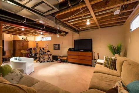 31 Unfinished Basement Ideas & Designs To Spruce Up Your Room (2021) Lighting Unfinished Basement Ceiling, Decorating Ideas For Unfinished Basement, Unfinished Basement Lighting, Finished Basement Bars, Basement Unfinished, Unfinished Basements, Unfinished Basement Walls, Unfinished Basement Bedroom, Basement Rooms