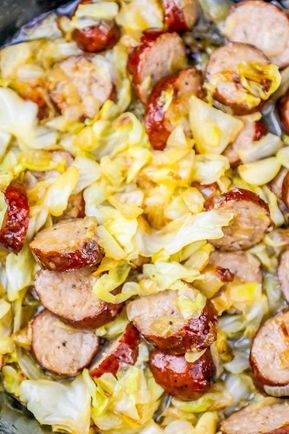 The Best Pan Fried Cabbage and Sausage Recipe Ever is the perfect easy way to celebrate Saint Patricks Day with a one pot cabbage and sausage dinner skillet that is low carb and keto diet compatible, family tested and approved, and goes from the fridge to the table in under 20 minutes in just one... One Pot Cabbage, Pan Fried Cabbage, Fried Cabbage And Sausage, Dinner Skillet, Sausage And Cabbage, Fried Cabbage With Sausage, Sausage Dinner, Cabbage And Sausage, Sausage Recipe