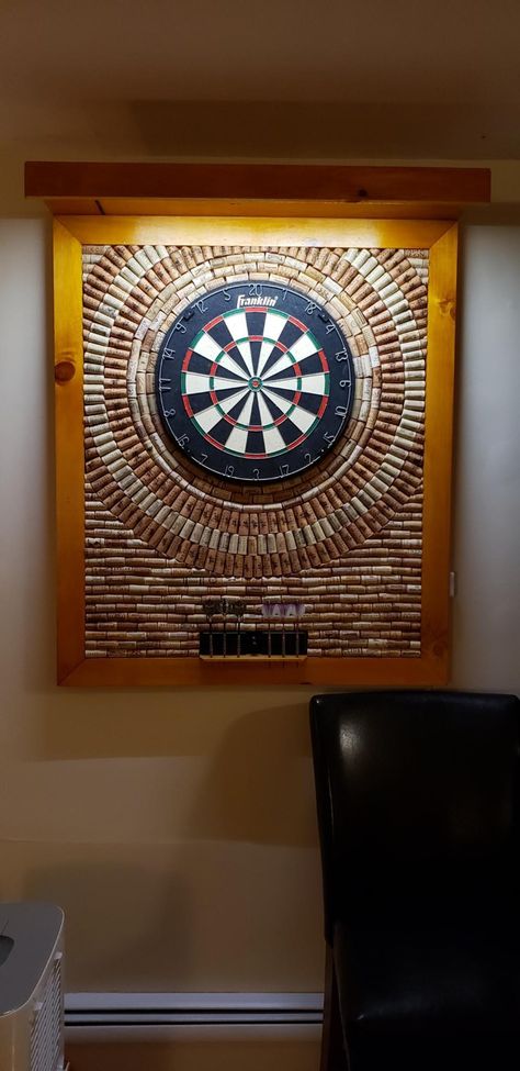 Wine corks attached with Gorilla Glue and Led tape lights above. Dart board screwed from back. Laser for oche line and dart storage. 36 x 42 Cork Dartboard, Dart Storage, Dart Board Wall, Ultimate Man Cave, Game Room Basement, Led Tape Lighting, Man Cave Home Bar, Cork Diy, Cork Art