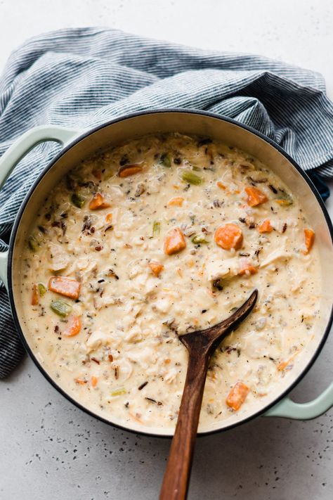 Chicken Wild Rice Soup is the ultimate comfort food to enjoy on cold days! It's rich and creamy, full of tender veggies, herbed chicken, and hearty wild rice. Don't forget the crusty bread for dunking! Creamy Chicken Wild Rice Soup Stovetop, Hearty Chicken Soup, Creamy Wild Rice Soup, Herbed Chicken, Chicken And Wild Rice Soup, Wild Rice Soup Recipes, Chicken Wild Rice, Chicken Wild Rice Soup, Creamy Chicken And Rice