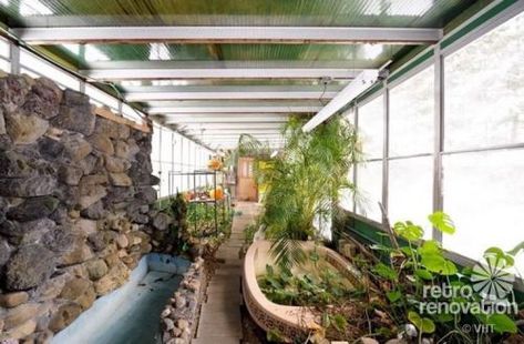 1952 time capsule house with luscious, original terracotta floors and attached greenhouse - Mcm Greenhouse, Porch Fountain, Mid Century Porch, Solarium Ideas, Attached Greenhouse, Time Capsule House, Alien House, Brick Floors, Retro Rooms