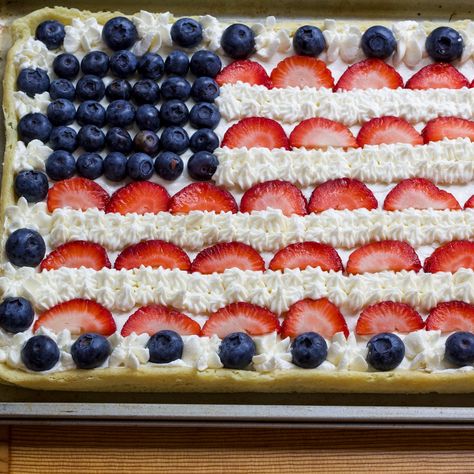 Celebrate holidays with an easy and patriotic fruit pizza recipe. Made with sugar cookie dough and topped with fresh berries, it's a festive dessert everyone will love. Fruit Pizza Recipe Easy, Cookie Dough Fruit Pizza, Fruit Pizza Recipes, Flag Dessert Pizza, American Flag Cookie Pizza, American Flag Fruit Pizza Sugar Cookie, Patriotic Fruit Pizza Sugar Cookie, Easy Dessert Pizza, Easy Fruit Pizza Sugar Cookie Pillsbury