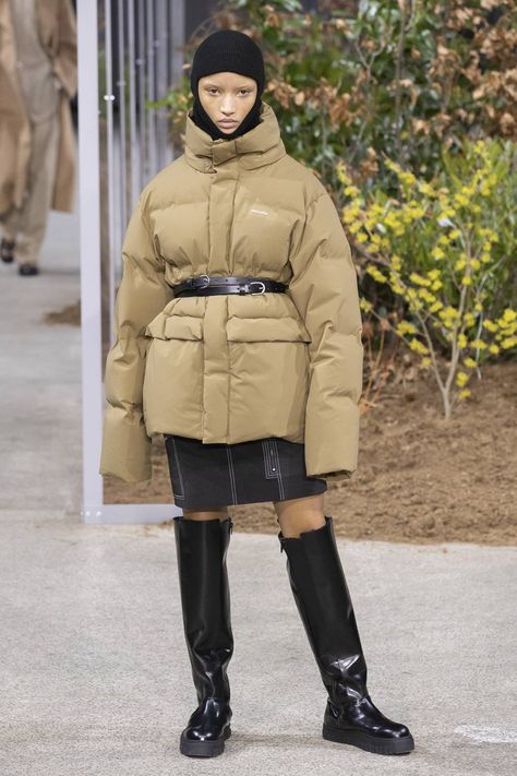 You'll rarely find us complaining that our [link url="https://www.glamourmagazine.co.uk/gallery/puffer-jackets-autumn-winter-2019"]puffers[/link] aren't giving us enough of a waist, but updating them via a belt this season Fitted Functional Puffer Outerwear, Functional Down Puffer Outerwear, Puffer Jacket With Belt, Designer Puffer Outdoor Outerwear, Oversized Functional Puffer Outerwear, Scandi Street Style, Sleeveless Trench Coat, Styling Hacks, Sleeveless Trench