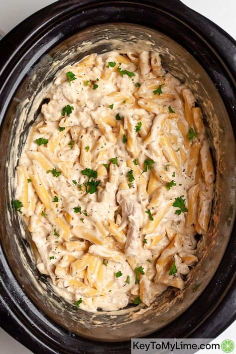 Homemade Crock Pot Chicken Alfredo made with cream cheese, heavy cream, and parmesan cheese is one of the best Crockpot meals! The juicy chicken is cooked perfectly in this easy dinner recipe. #SlowCookerChicken #SlowCookerPasta #SlowCookerAlfredo #CrockPotAlfredo #ChickenAlfredo KeyToMyLime.com Easy Chicken Alfredo Pasta, The Best Crockpot Chicken, Best Crockpot Chicken, Crockpot Chicken Alfredo, Chicken Alfredo Recipe, Alfredo Recipes, Pantry Layout, Resep Pasta, Pasta Recipes Alfredo