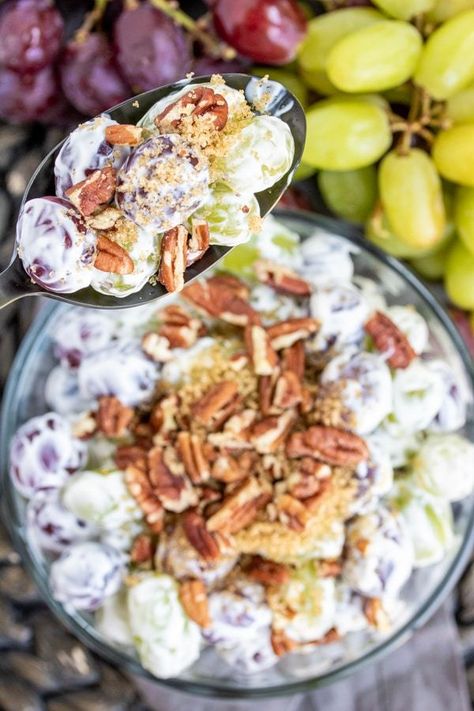 This Easy Grape Salad recipe is a creamy fruit salad made with cream cheese and sour cream tossed with grapes, and topped with brown sugar and crunchy pecans. It's an easy Southern side dish that is perfect for summer parties, BBQs, and potlucks. This dessert salad can even be made with Butterfingers or Snickers! #fruitsalad #potluckrecipes #grapes #dessert #creamcheese #homemadeinterest Fruit Sald, Grapes Dessert, Thanksgiving Fruit Dessert, Easy Grape Salad, Thanksgiving Muffins, Fruit Salad With Cream, Sour Cream Potato Salad, Creamy Fruit Salad, Summer Potluck Recipes