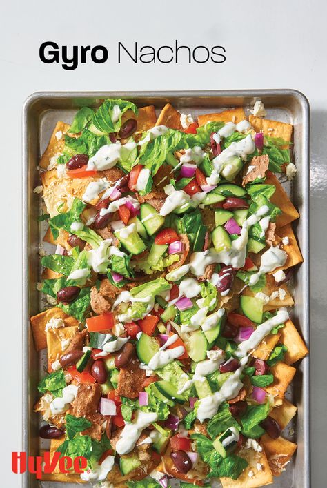 Time to Greek out on nachos! We used pita chips instead of nacho chips and frozen fully cooked gyro meat slices to make a shareable platter of everyone's favorite appetizer. Look for tzatziki Greek yogurt dip or tzatziki sauce to drizzle on top. We also love this easy recipe for a quick dinner or lunch idea. Find everything you need at your local Hy-Vee or shop online at Hy-Vee.com. Greek Nachos, Greek Yogurt Dip, Beef Gyro, Greek Foods, Chicken And Bacon, Nacho Chips, Yogurt Dip, Lunch Idea, Tzatziki Sauce