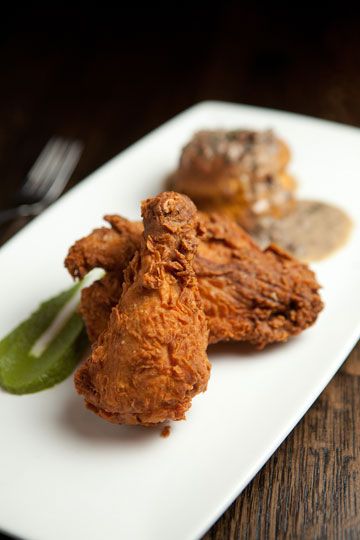 Using local, seasonal ingredients, Blood & Sand's Chris Bork crafts  sophisticated comfort food. Fried chicken has subtle heat from  ginger and is plated with a sweet potato biscuit and gizzard  gravy. Fried Chicken Plating Ideas, Fried Chicken Plating, Food Fried Chicken, Fancy Plating, Chicken Goujons, Plating Ideas, Sweet Potato Biscuits, Plate Presentation, Chicken Plating